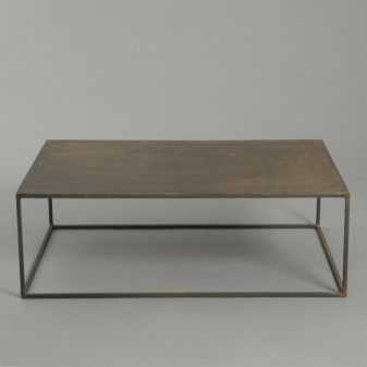 A mid-century modernist steel low table