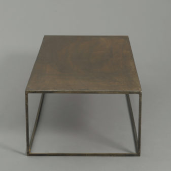 A mid-century modernist steel low table