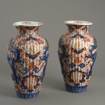 A pair of 19th century imari dragon vases