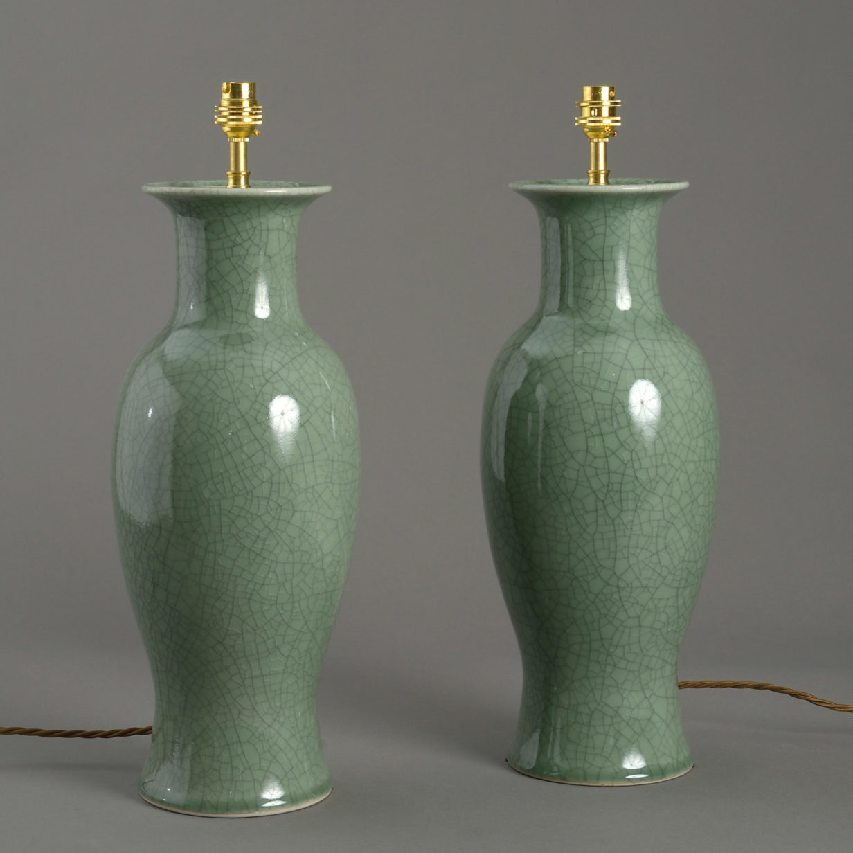 A pair of celadon crackle glazed vase lamps
