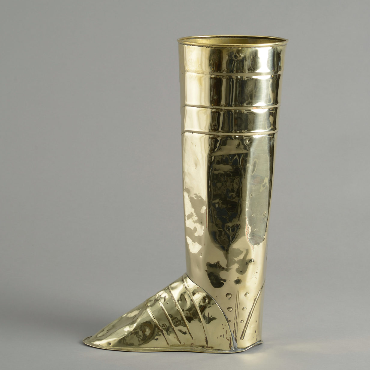 A 19th century brass boot stick stand