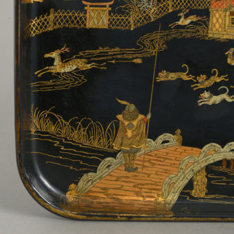 A black and gold lacquer tray