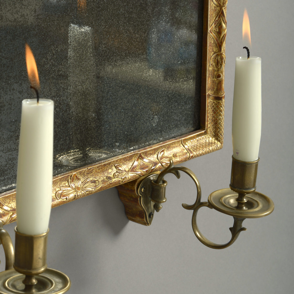 An 18th century george i period gilt gesso girandole mirror