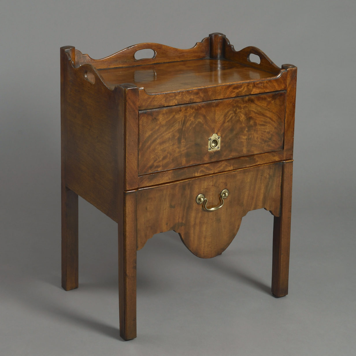 An 18th century pair of mahogany bedside cabinets