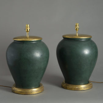 A pair of green glazed ceramic jar lamps