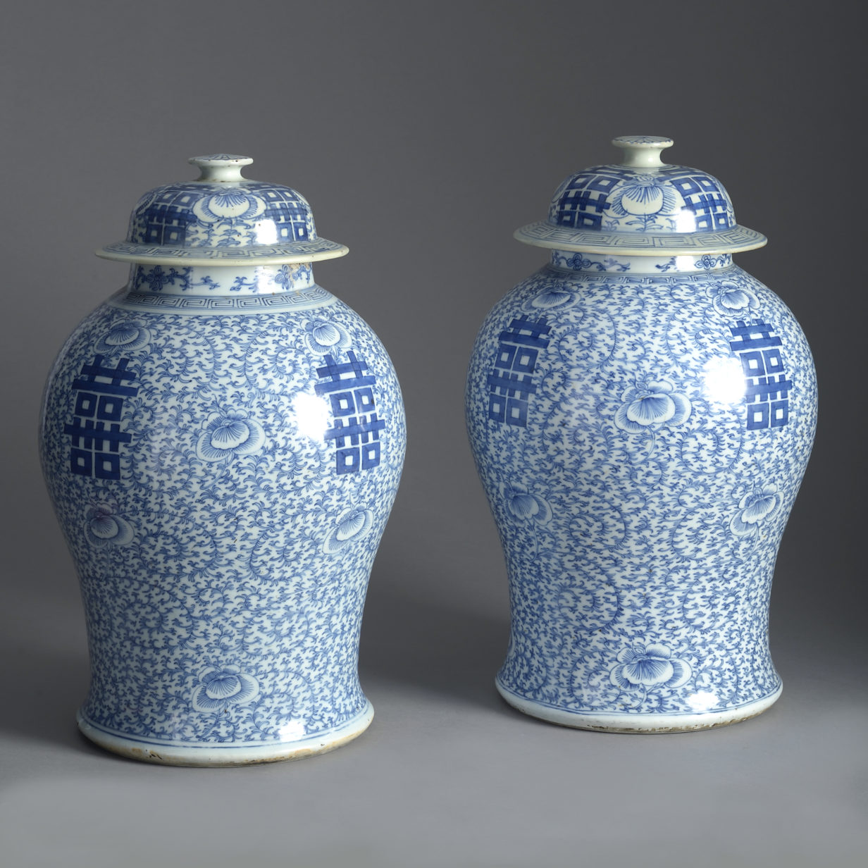 19th century pair of blue and white porcelain vases and covers