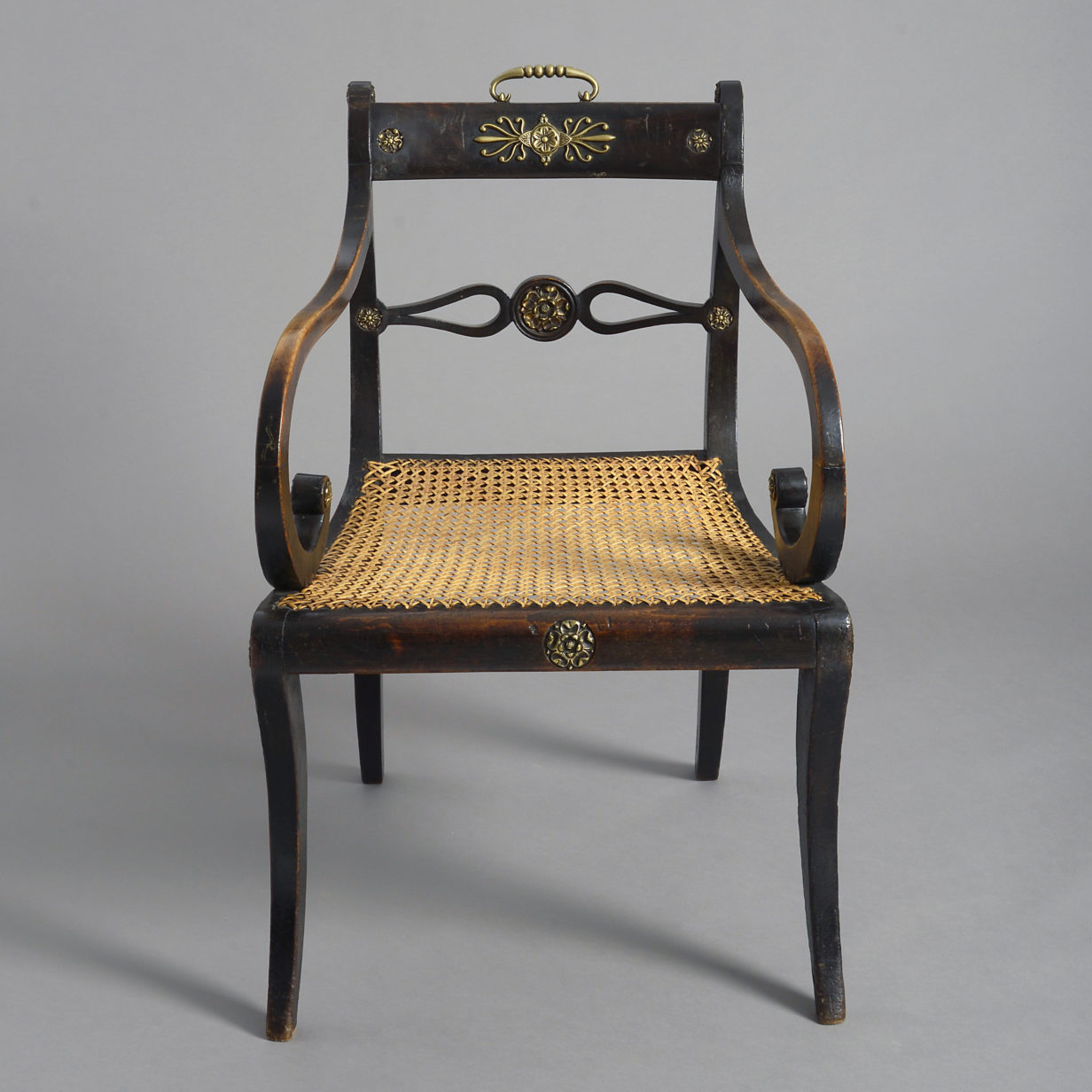 An Early 19th Century Regency Period Ebonised Armchair
