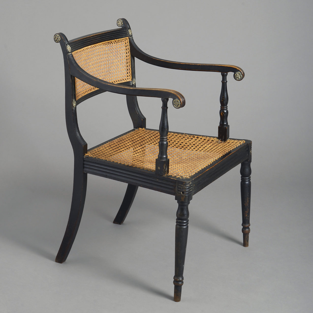 Early 19th century regency period ebonised armchair