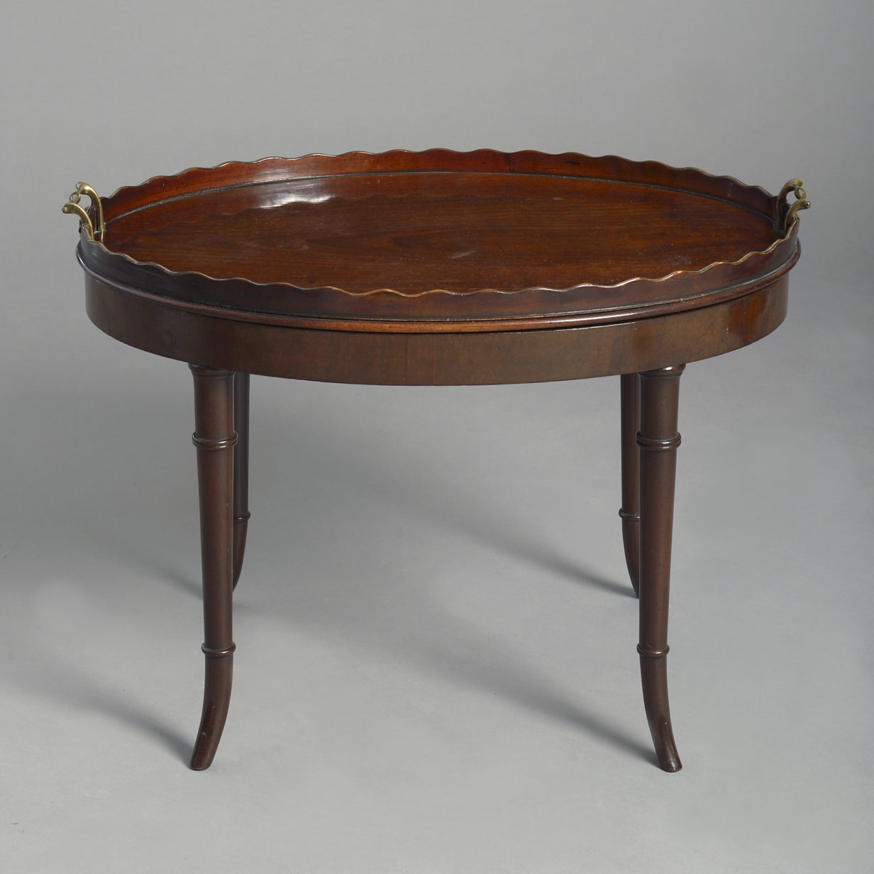 An early 19th century george iii period mahogany tray as a low table