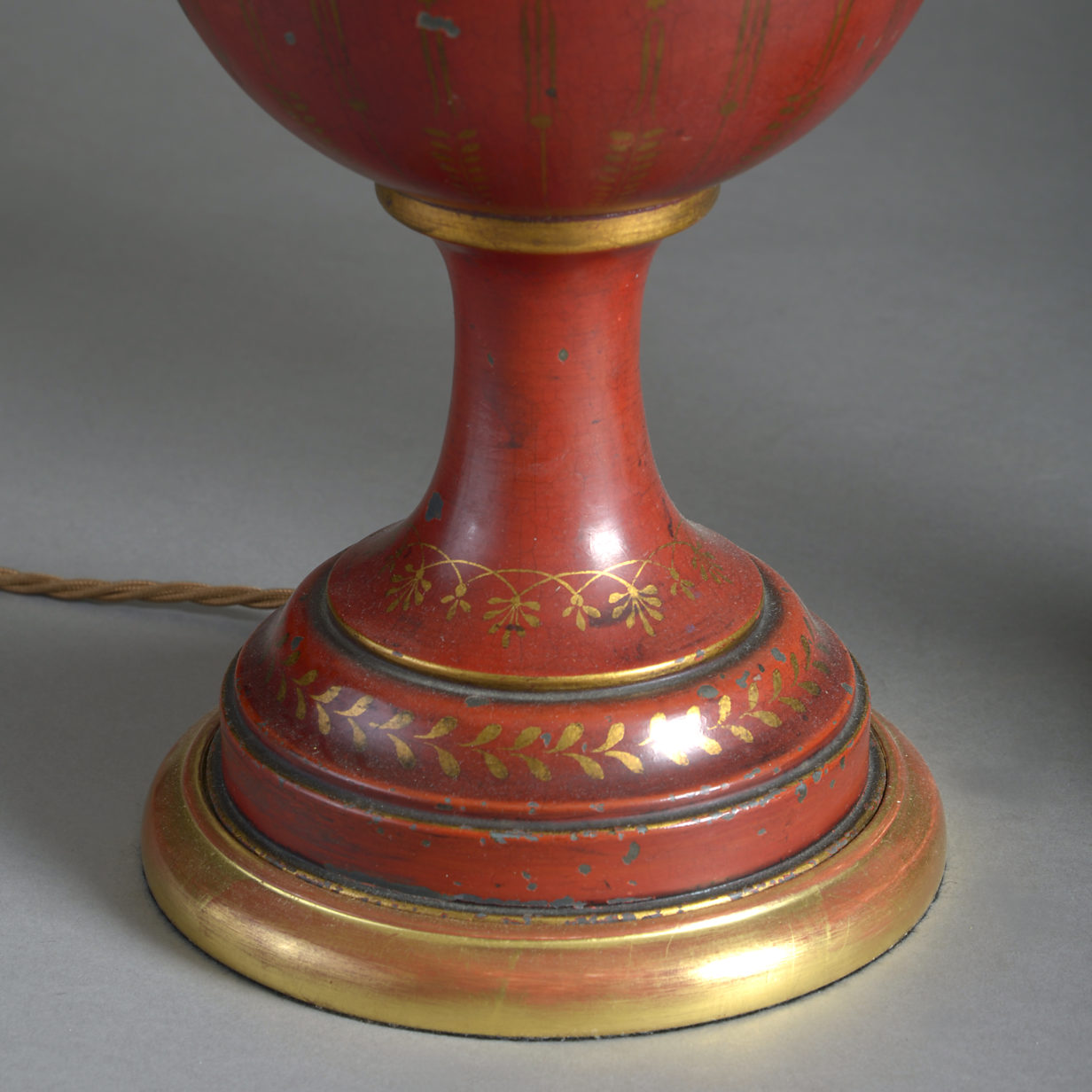 Pair of red tole lamps