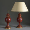 Pair of red tole lamps