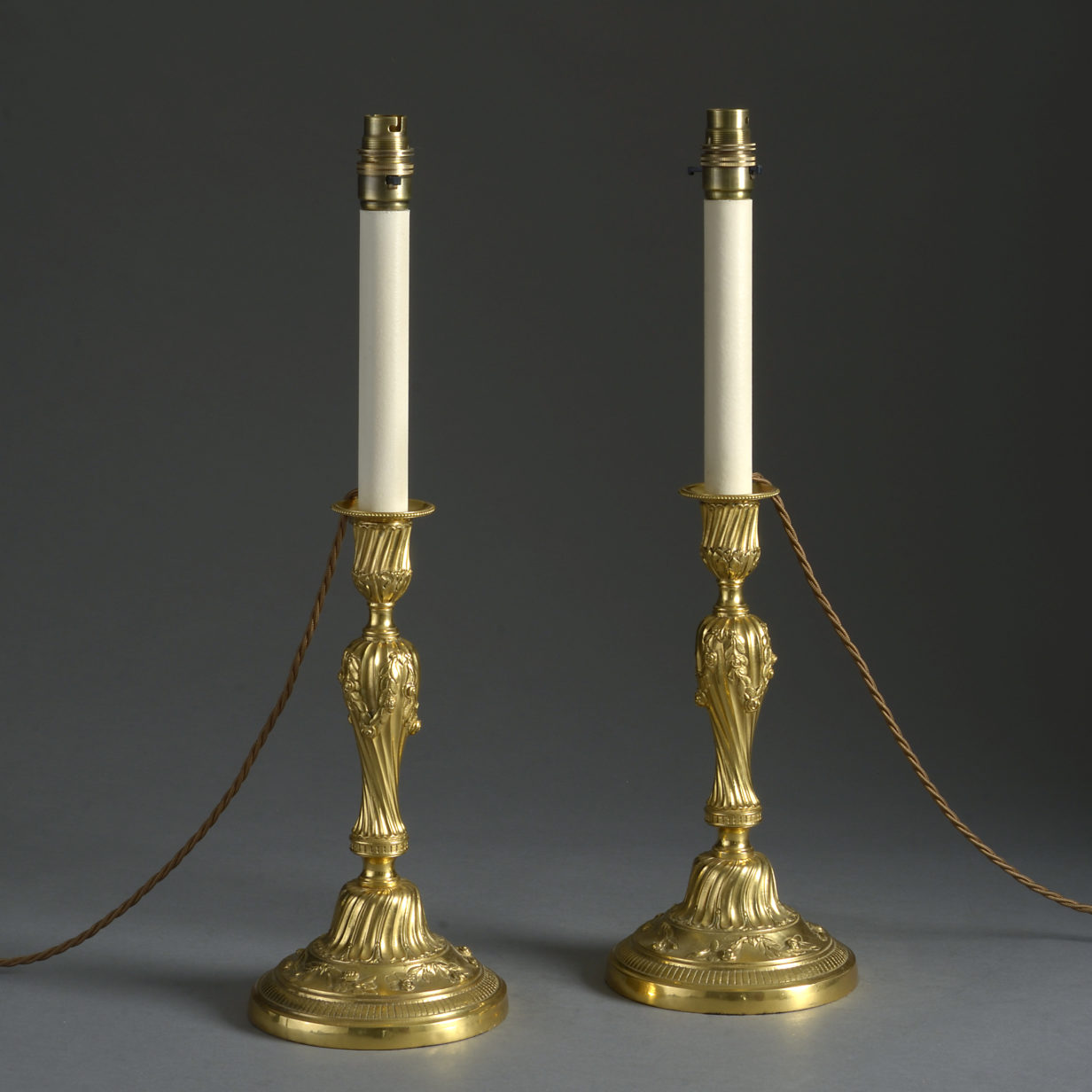 Pair of 19th century louis xv style rococo ormolu candlestick lamps