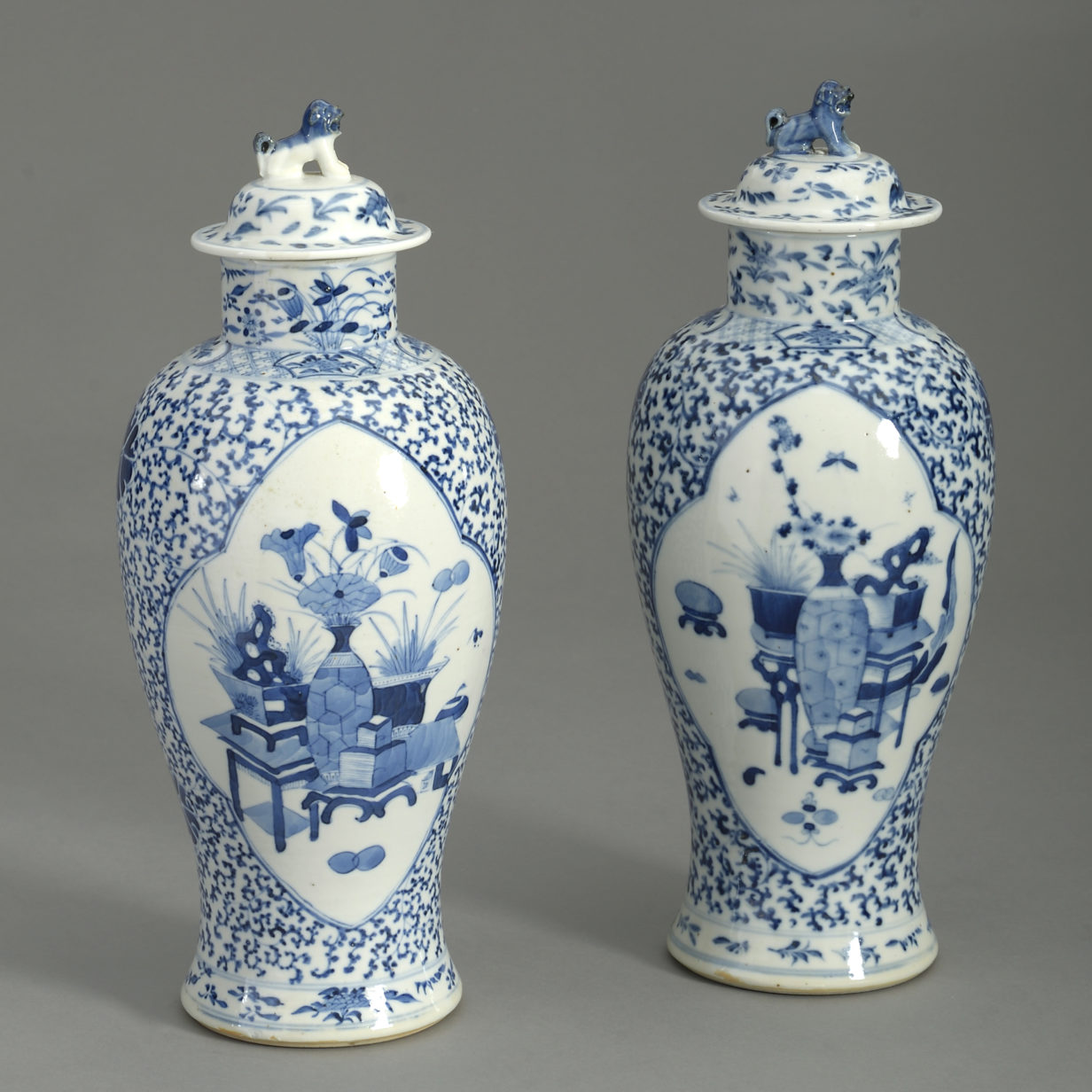 Pair of 19th century blue and white vases and covers
