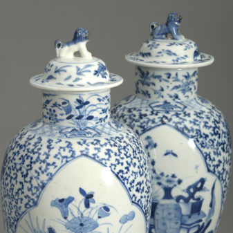 Pair of 19th century blue and white vases and covers