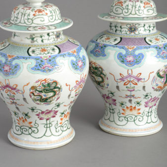 Pair of 19th century famille rose porcelain vases and covers
