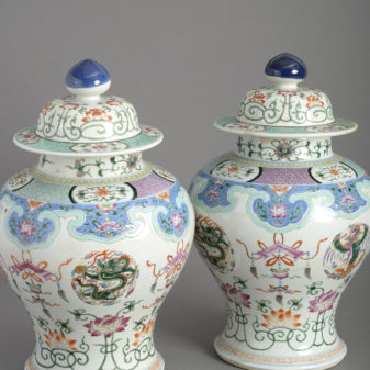 Pair of 19th century famille rose porcelain vases and covers