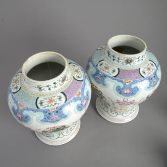 Pair of 19th century famille rose porcelain vases and covers