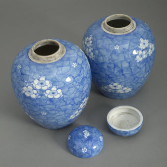 Pair of 19th century blue and white glazed jars and covers