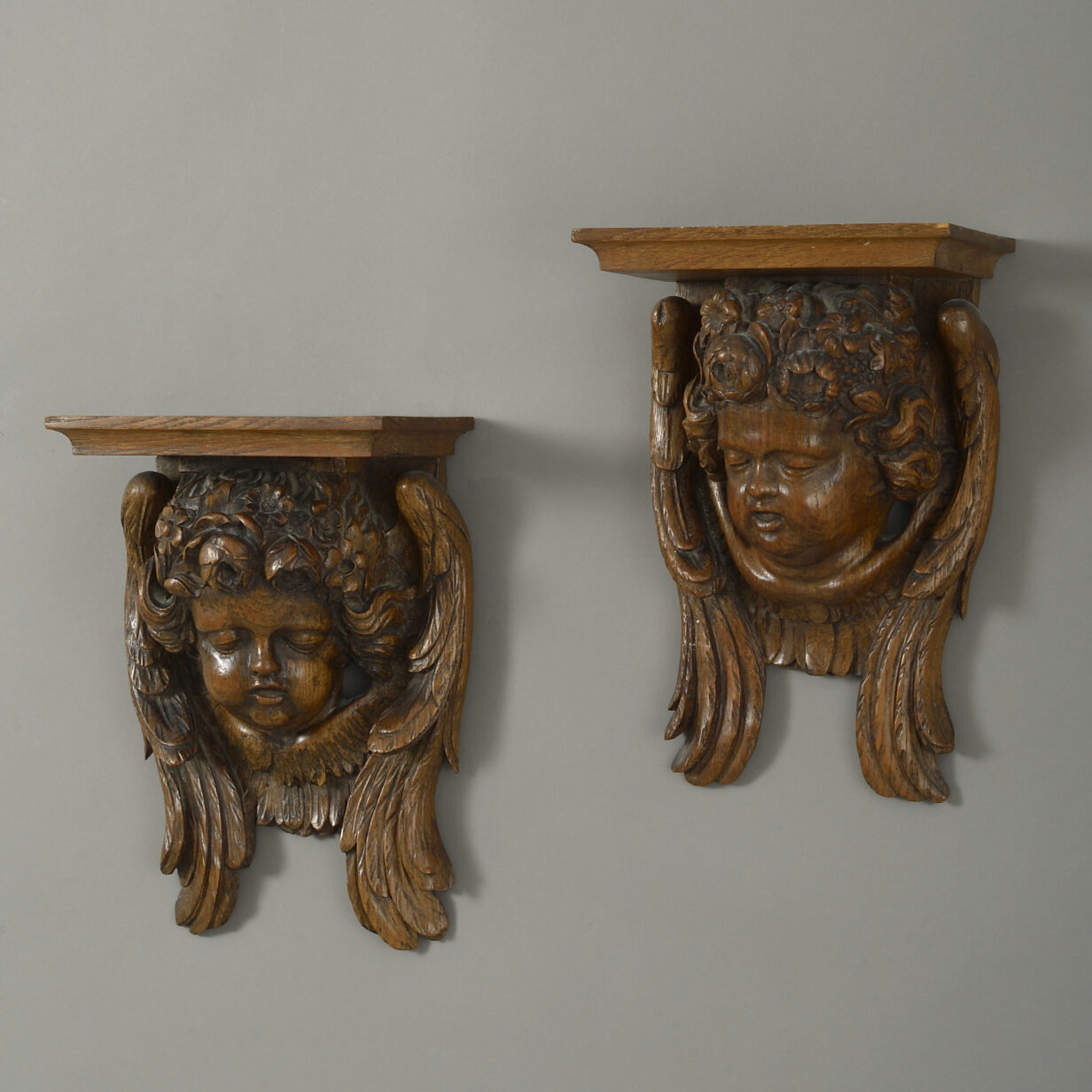Pair of 19th century carved wooden cherub wall brackets