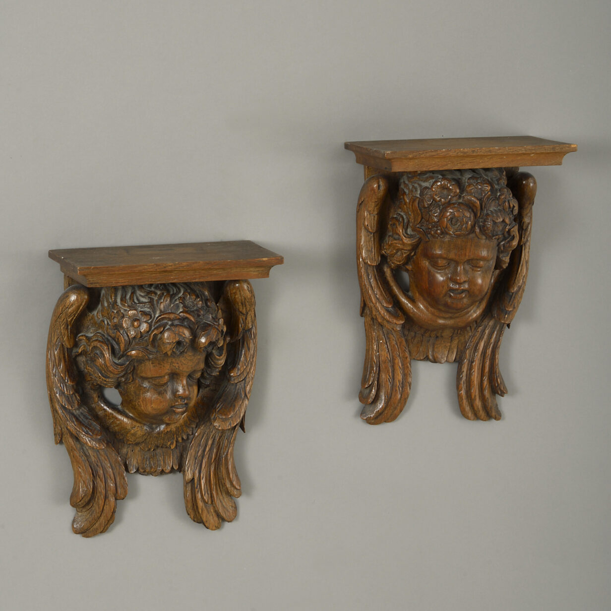 Pair of 19th century carved wooden cherub wall brackets