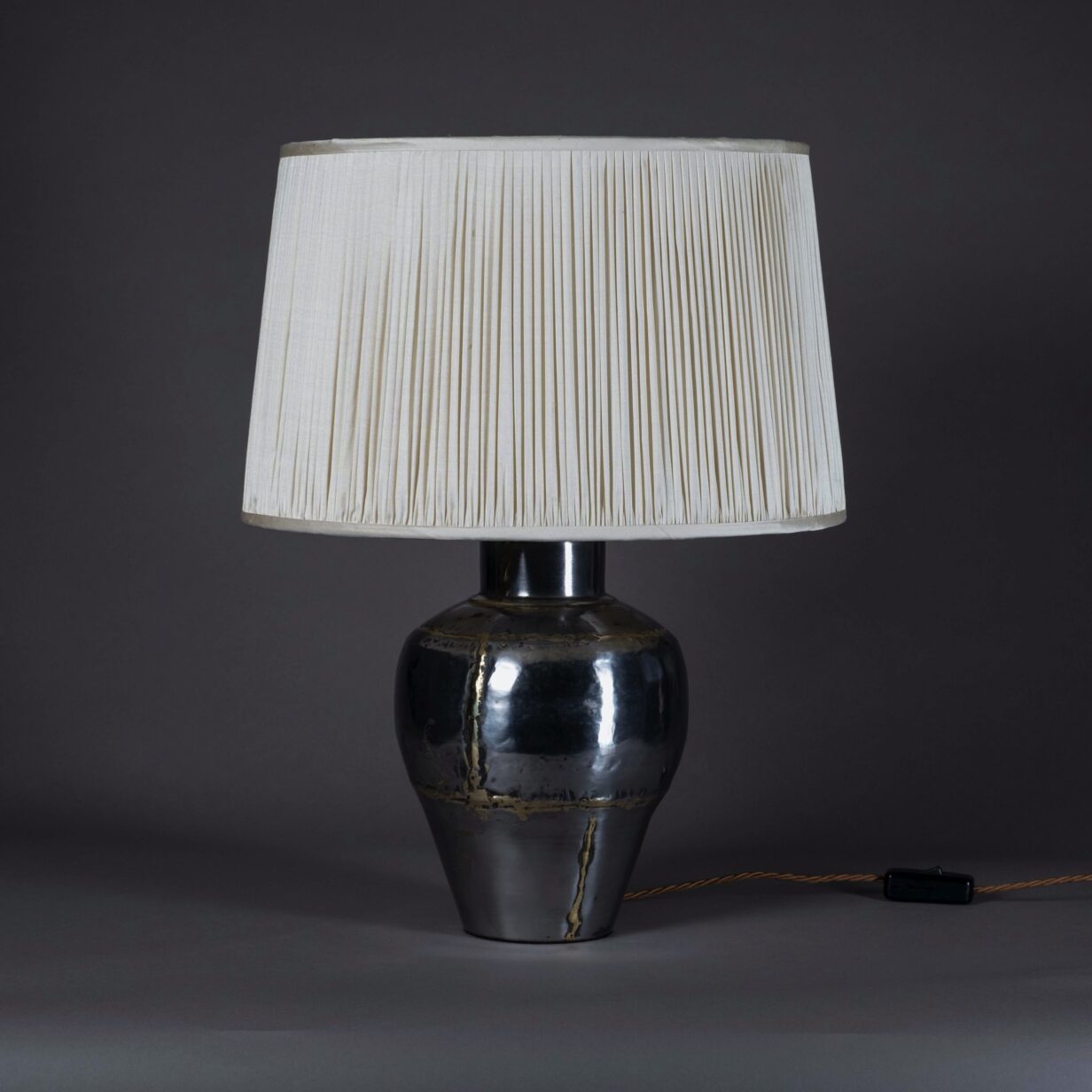 20th century polished steel & brass seamed vase lamp