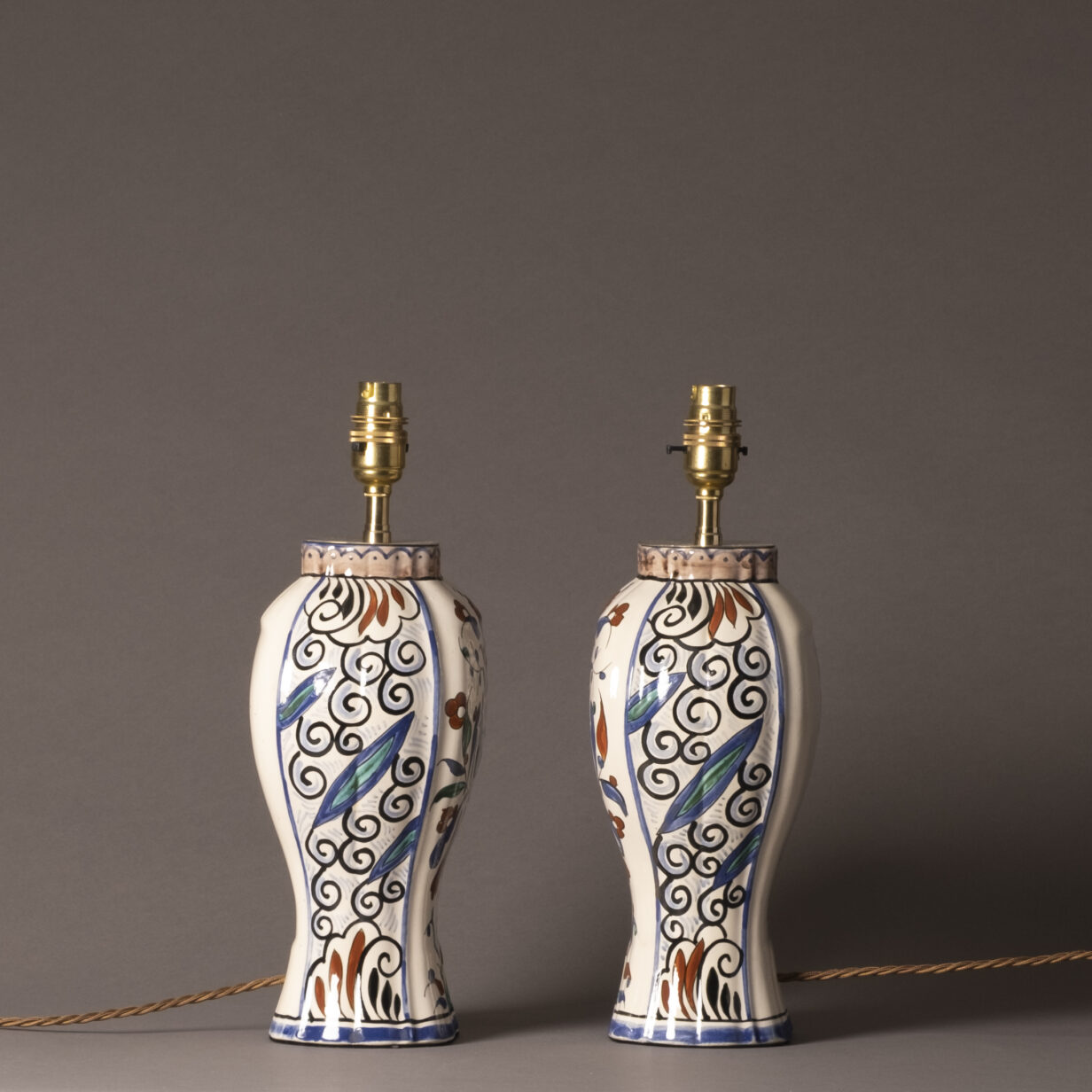 Pair of early 20th century faience vase lamps