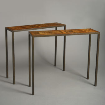 Pair of parquetry and iron console tables