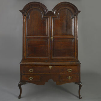 Double domed cabinet on stand