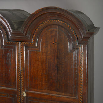 Early 18th century double domed oak cabinet on stand