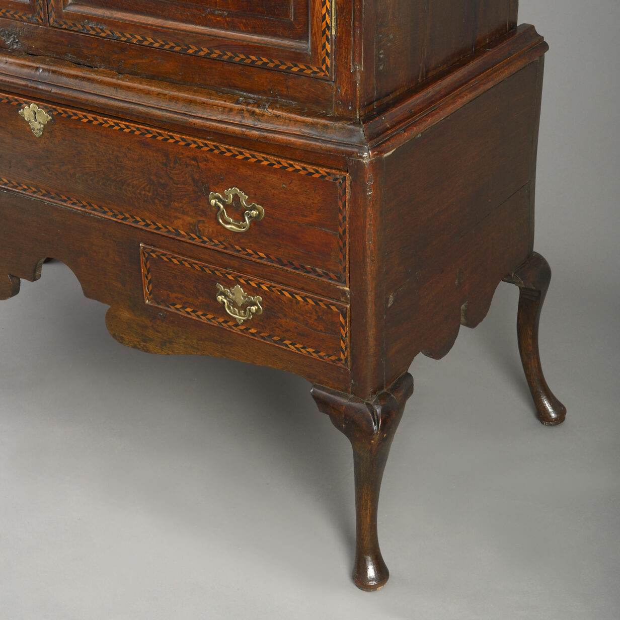 Early 18th century double domed oak cabinet on stand