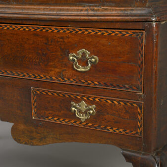 Early 18th century double domed oak cabinet on stand