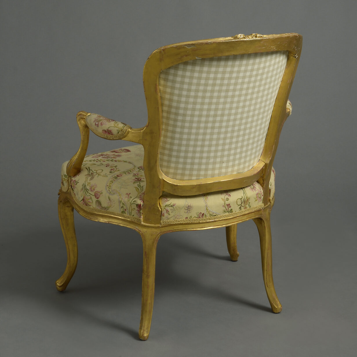 A close pair of louis xv giltwood rococo fauteuil armchairs