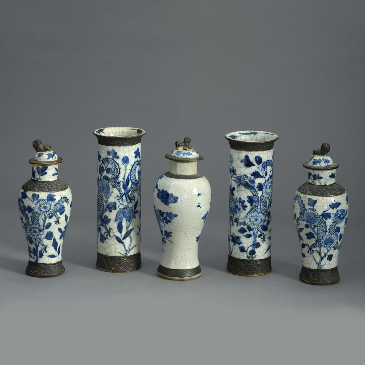 Garniture of five crackle vases
