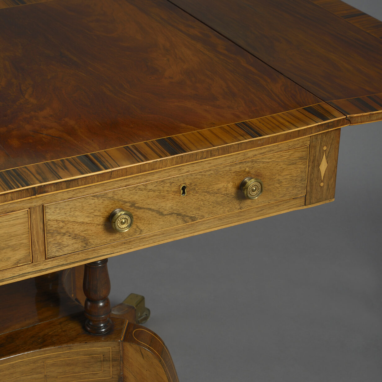 Early 19th century regency period rosewood and calamander wood sofa table