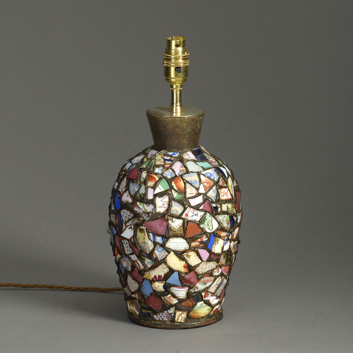 An unusual ceramic collage lamp