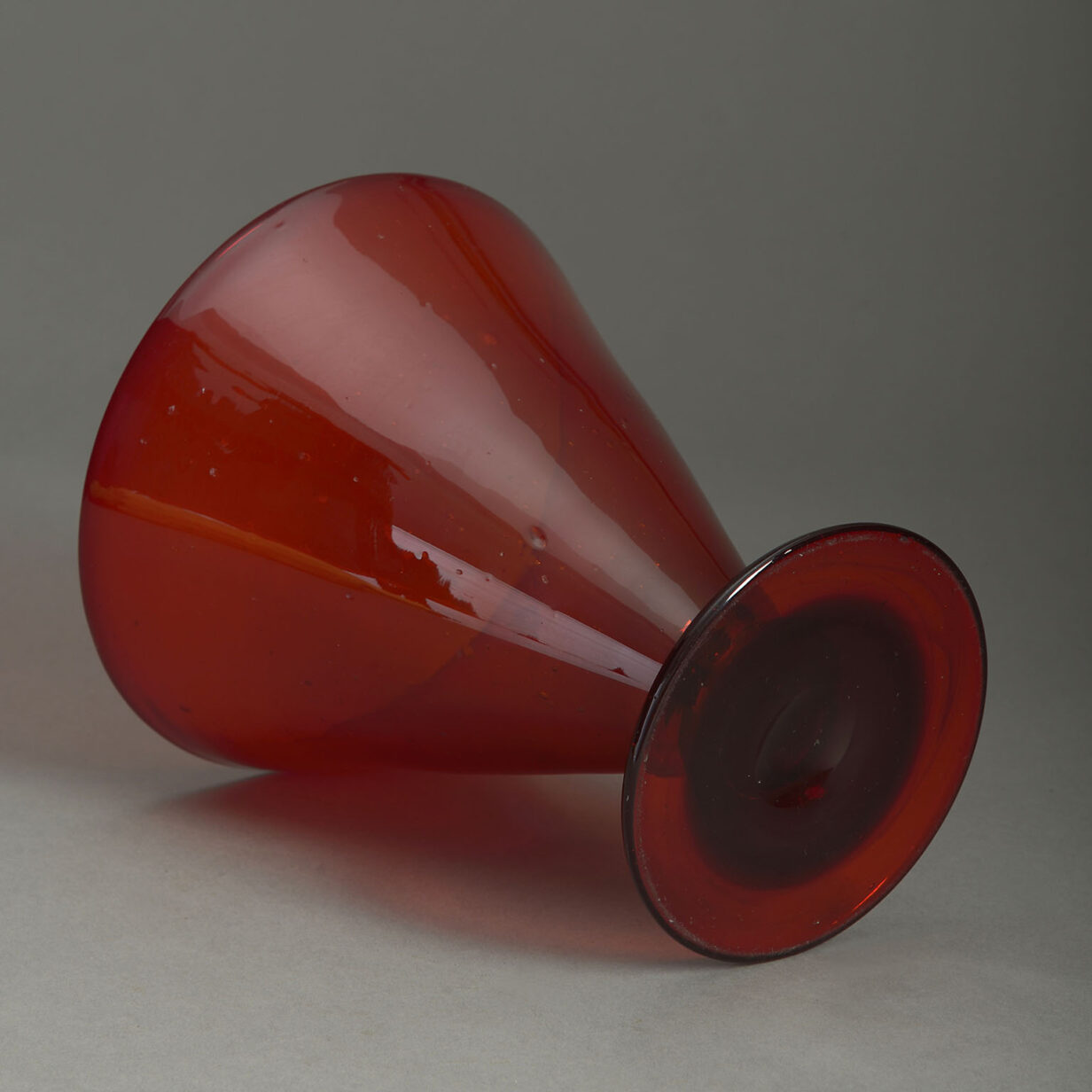 Conical red glass vase