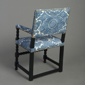 Pair of ebonised armchairs