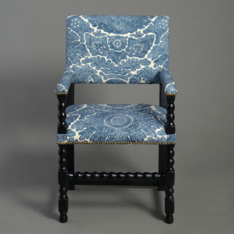 Pair of ebonised armchairs