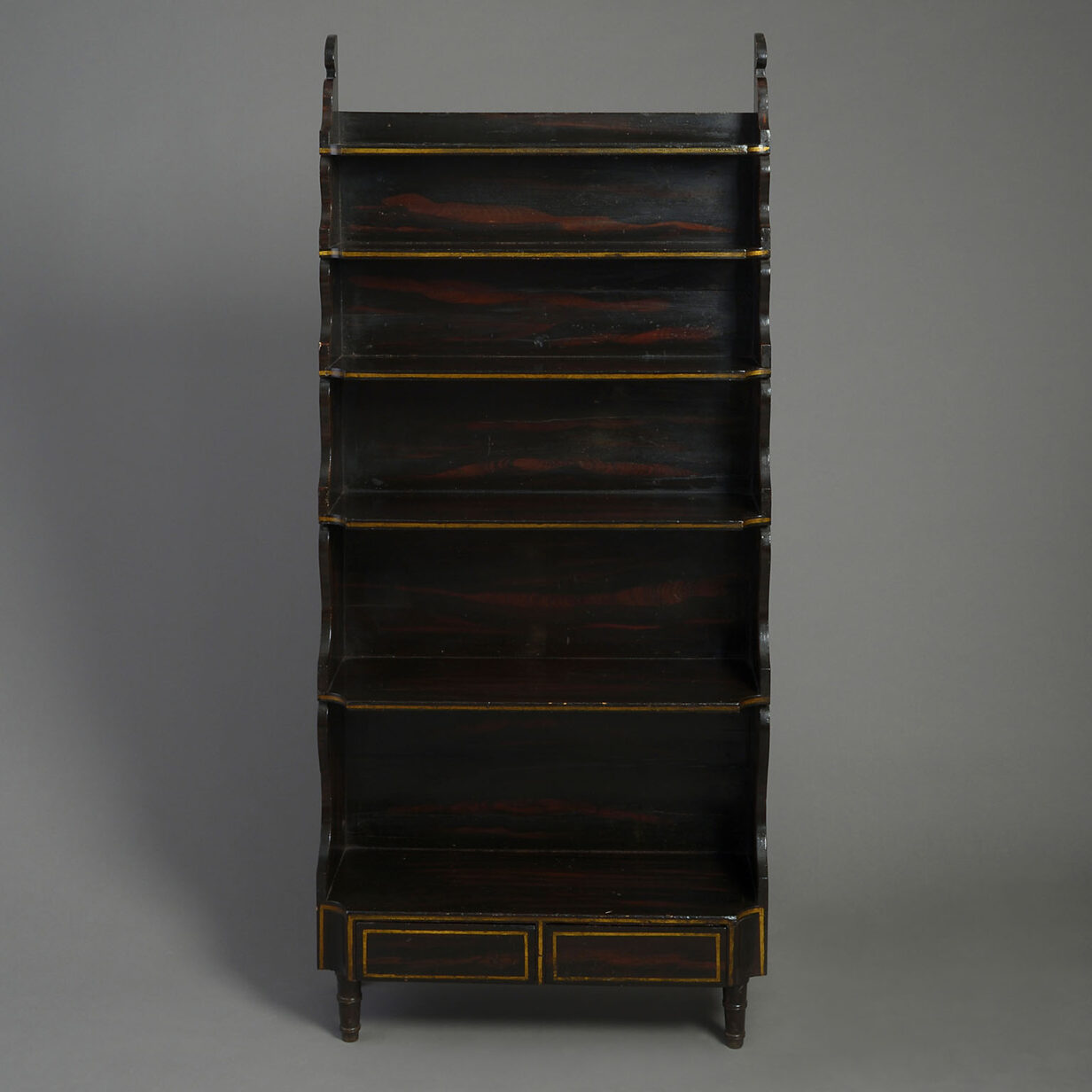 Early 19th century regency period faux rosewood painted waterfall bookcase