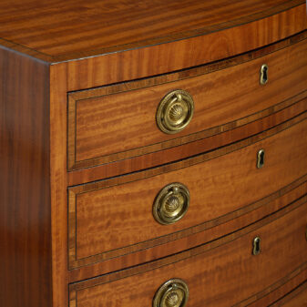 Small scale regency period bow front satinwood chest of drawers