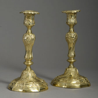 Pair of rococo brass candlesticks