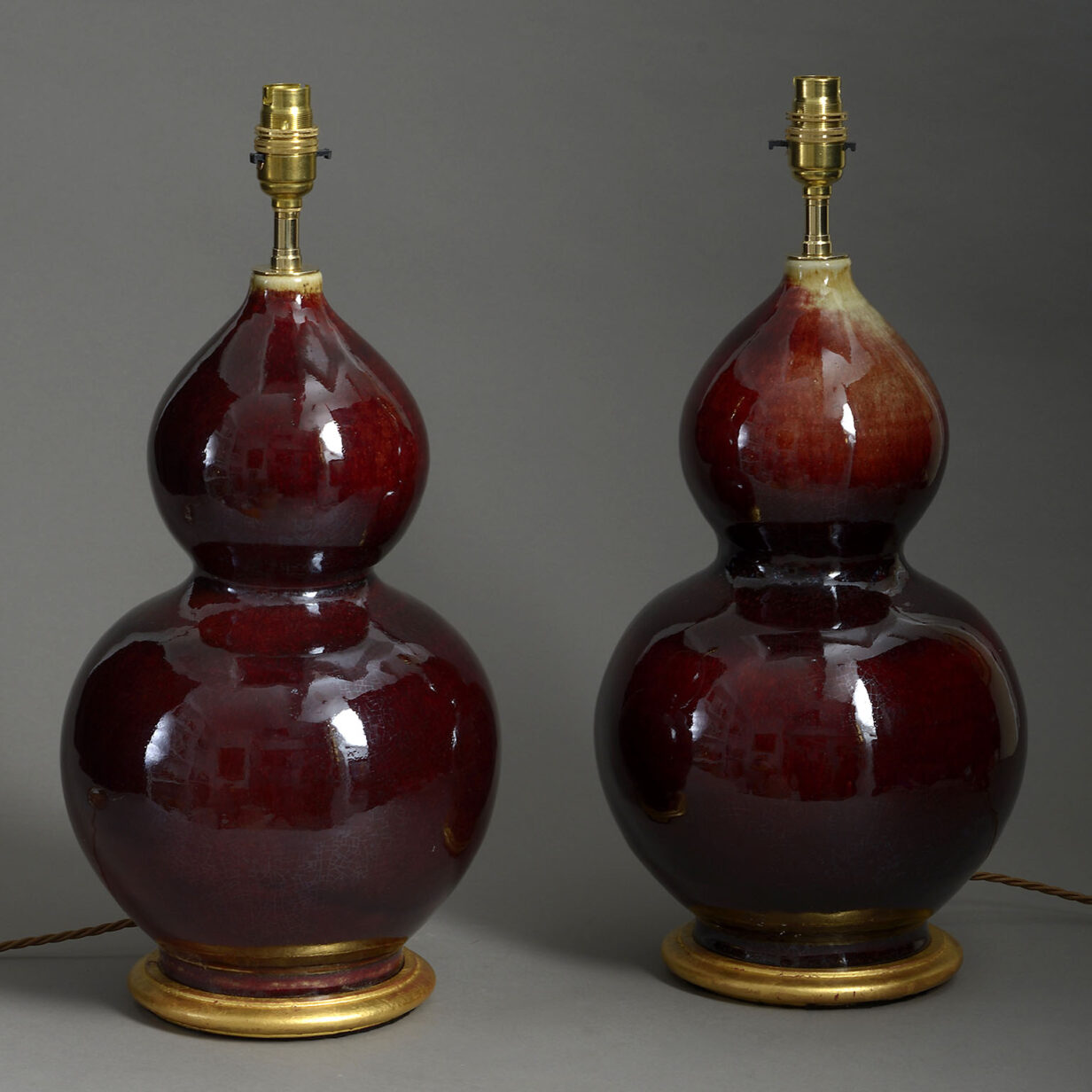Pair of sang de boeuf gourd vase lamps