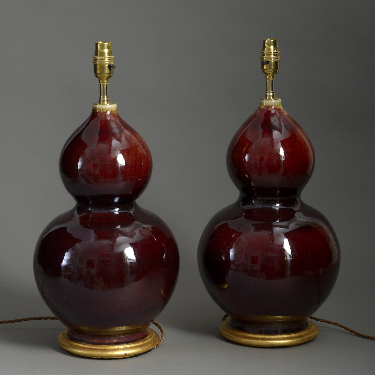 Pair of sang de boeuf gourd vase lamps