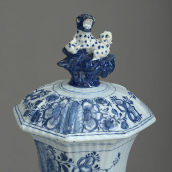 Pair of 19th century blue and white delft pottery vases and covers