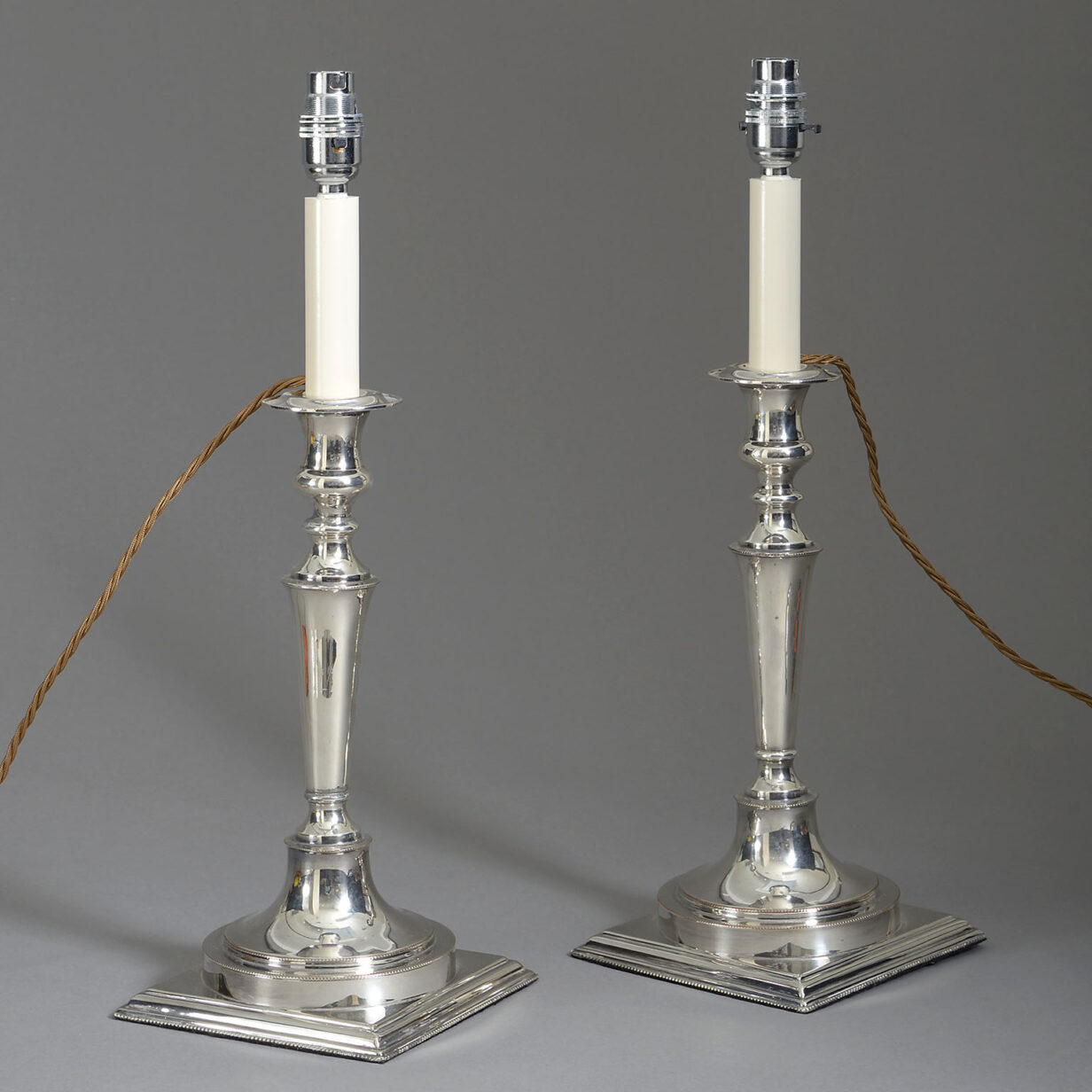 Pair of silvered candlestick lamps