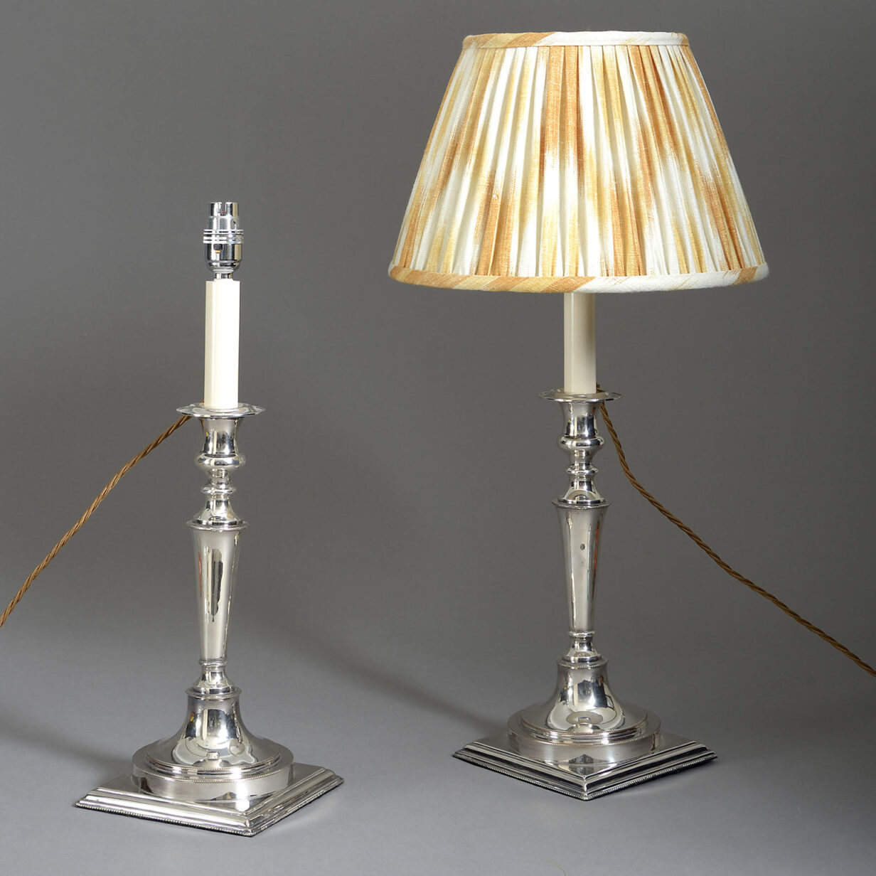 Pair of silvered candlestick lamps