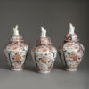Garniture of three imari vases
