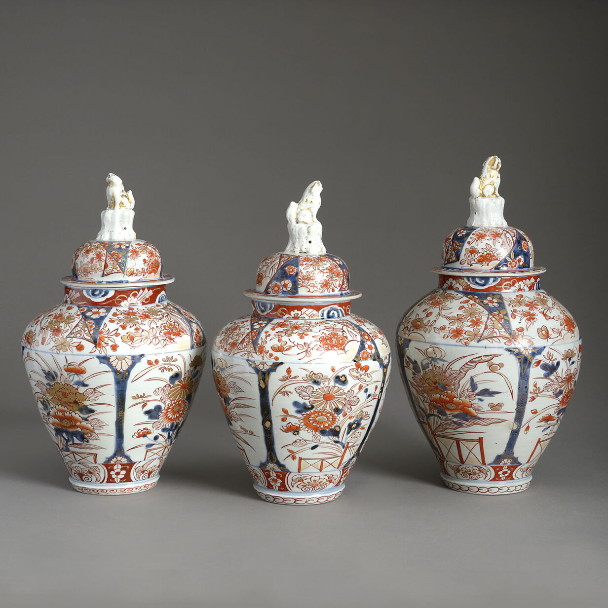 Garniture of three imari vases