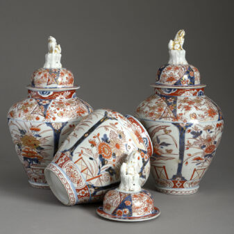 Garniture of three early 18th century imari porcelain vases and covers