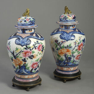 A pair of 19th century imari style faience pottery vases and covers, french, circa 1830